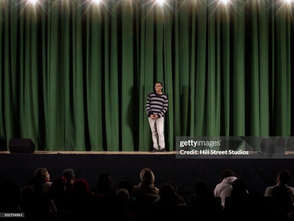 Student performing on high school stage