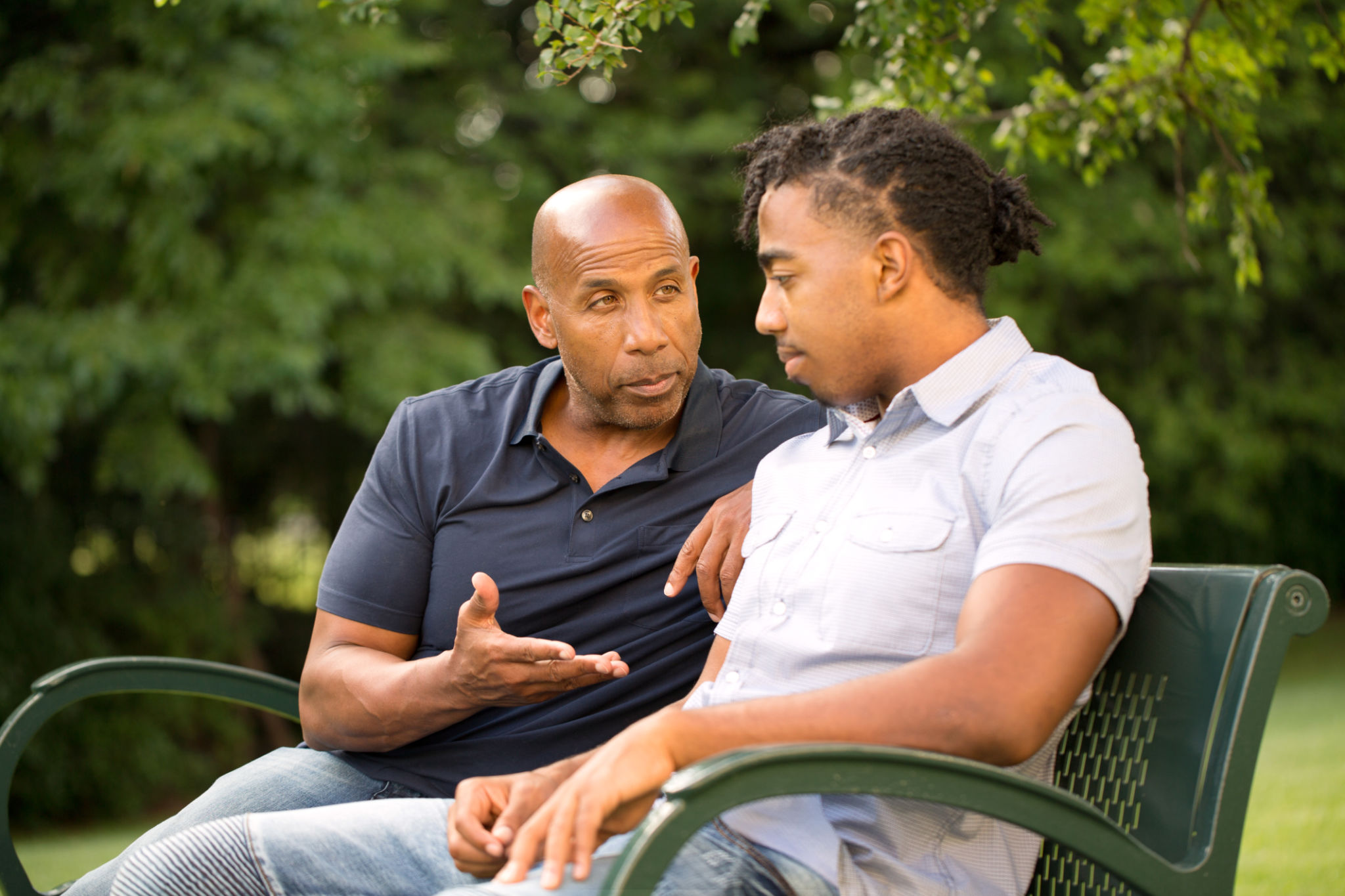 Mature man mentoring and giving advice to a younger man. Mature man mentoring and giving advice to a younger man.