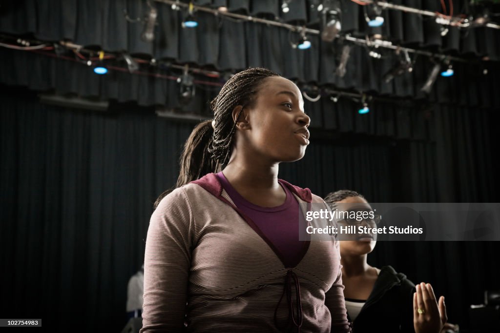 Students standing on high school stage