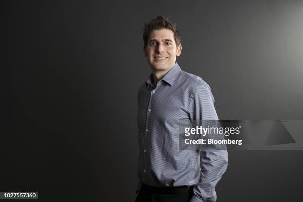 Eduardo Saverin, co-founder and partner of B Capital Group, poses for a photograph during the Bloomberg Sooner Than You Think technology summit in...