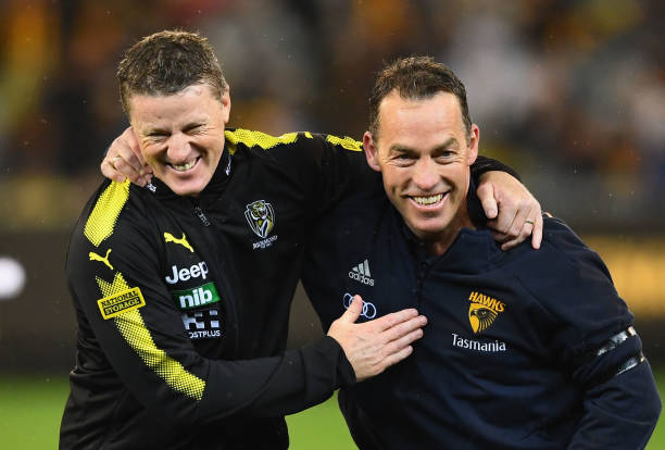 Tigers head coach Damien Hardwick and Hawks head coach Alastair Clarkson hug before the start of the AFL First Qualifying Final match between the...