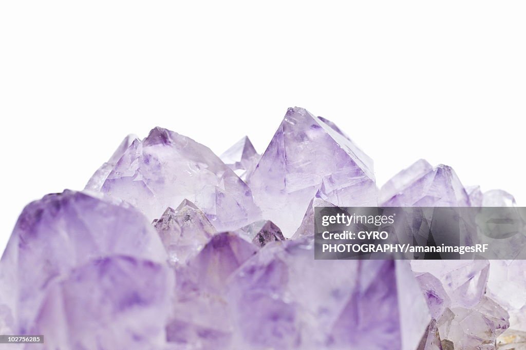 Amethyst crystals, close up, white background