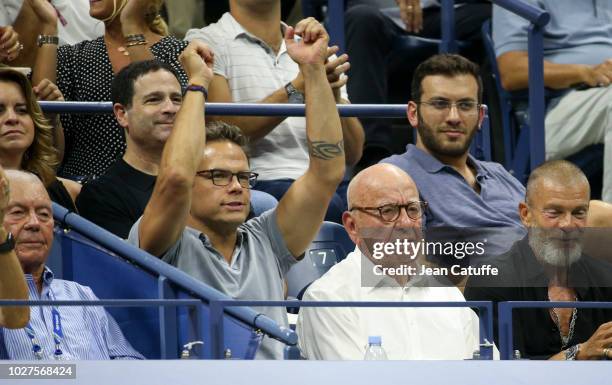 Rupert Murdoch and his son Lachlan Murdoch attend the quarter-final match of countryman John Millman of Australia against Djokovic on day 10 of the...