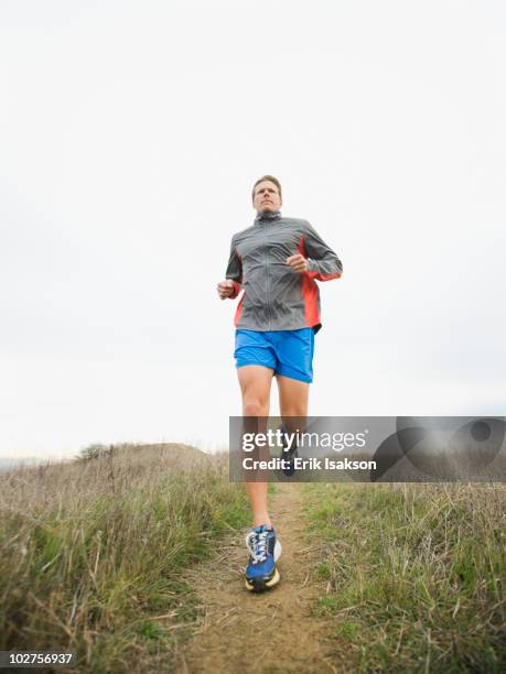 1,225 Man Running On Path Through Field Stock Photos, High-Res Pictures ...
