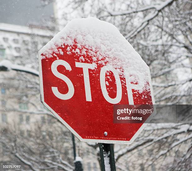 snow covered stop sign - dropped ice block stock pictures, royalty-free photos & images