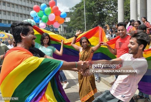 Indian members and supporters of the lesbian, gay, bisexual, transgender community celebrate the Supreme Court decision to strike down a colonial-era...