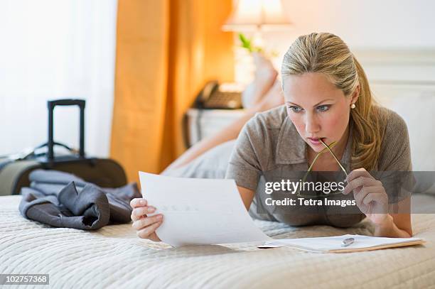 woman working in hotel room - en suite stock pictures, royalty-free photos & images