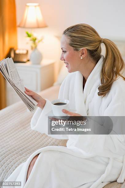 woman drinking coffee in hotel room - en suite stock pictures, royalty-free photos & images