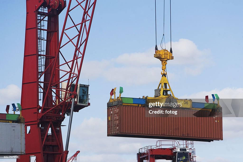 Crane lifting shipping container