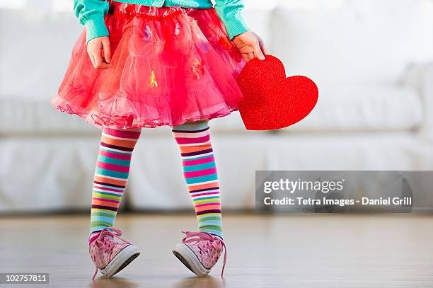 young girl wearing colorful tights - vestido-de-colores fotografías e imágenes de stock