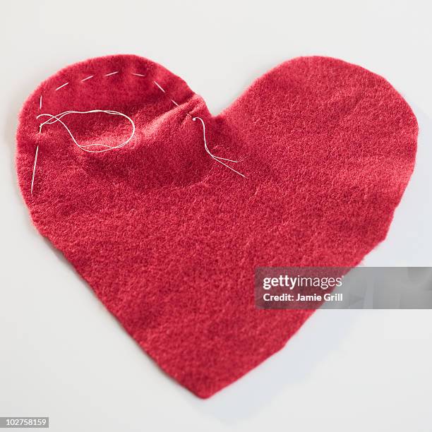 stitched red heart - seam stock pictures, royalty-free photos & images