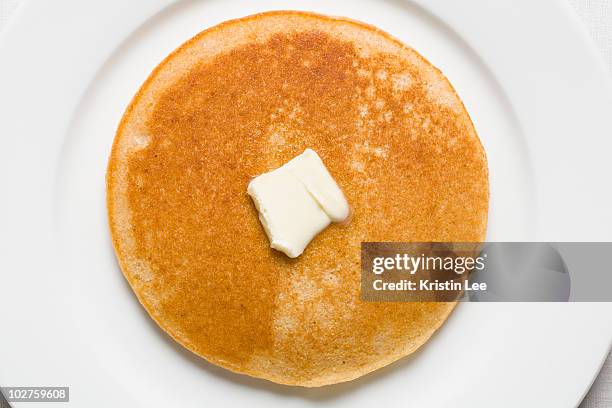 pancake and butter on plate - pancake stock pictures, royalty-free photos & images