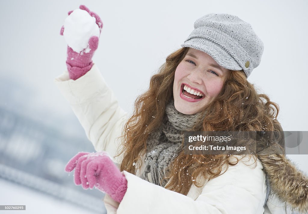 Woman throwing a snowball