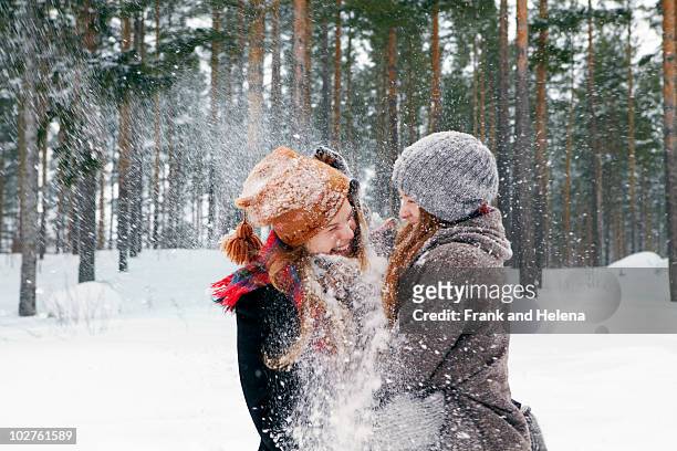 snow fight - winter friends playing stock-fotos und bilder