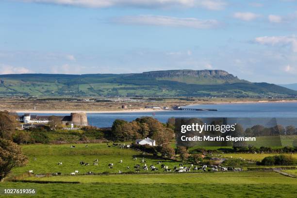 view over greencastle on inishowen peninsula, county donegal, ireland, with magilligan point and binevenagh mountain in derry at the rear, northern ireland, british isles, publicground - county donegal stock pictures, royalty-free photos & images