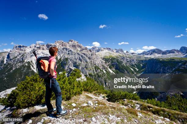 hiker on monte piano overlooking the alta pusteria valley, with the rienz valley at the rear, dolomites, alto adige, italy - classic sporting vantage points stock pictures, royalty-free photos & images