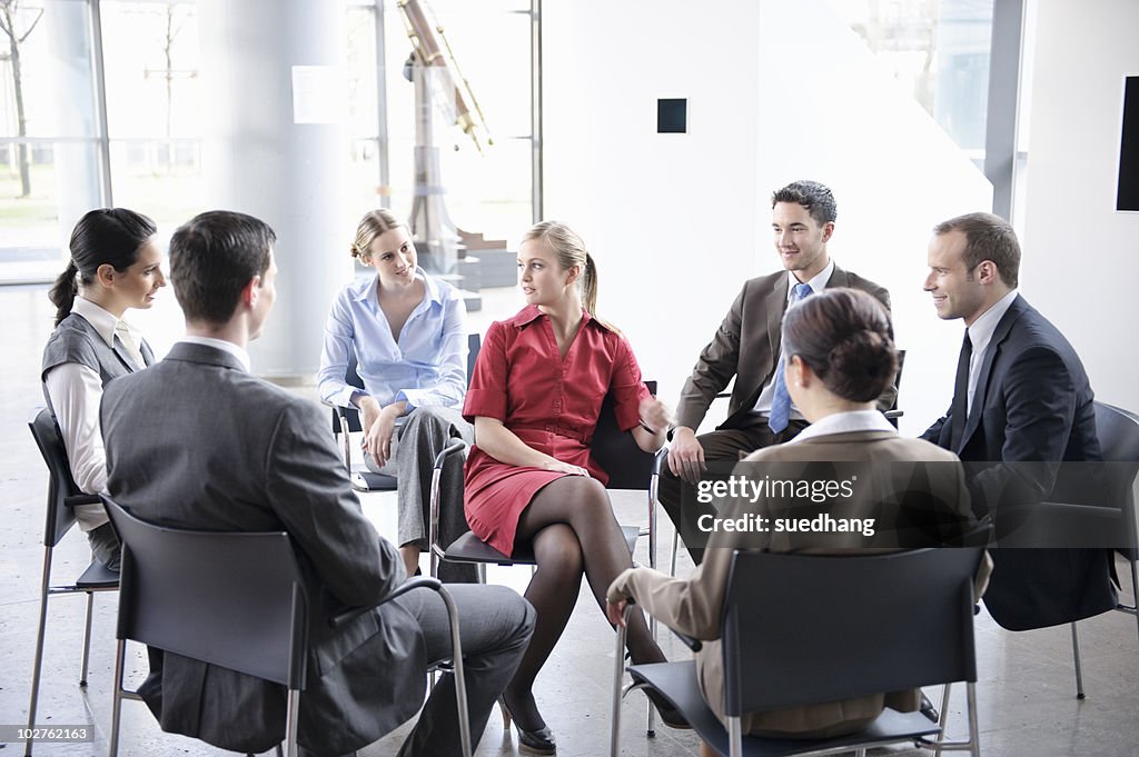 Group of people sitting in circle