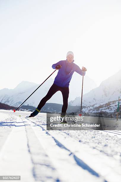 man cross-country skiing - cross country skis stock-fotos und bilder