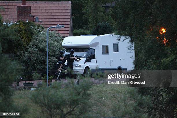 Police negotiate with a man fitting the description of fugitive gunman Raoul Moat on July 9, 2010 in Rothbury, England. Police are negotiating with a...