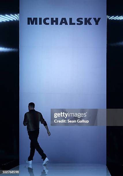 Designer Michael Michalsky presents himself on the runway following the Michalsky Show at the Michalsky Style Nite at Tempodrom during the Mercedes...