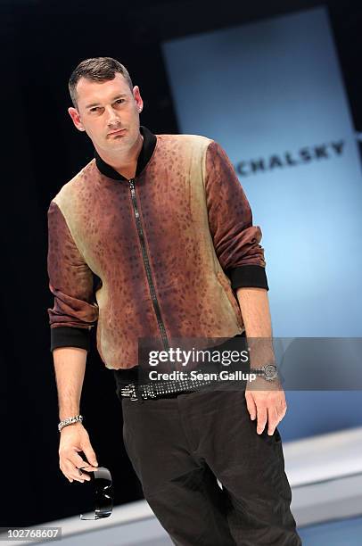 Designer Michael Michalsky presents himself on the runway following the Michalsky Show at the Michalsky Style Nite at Tempodrom during the Mercedes...