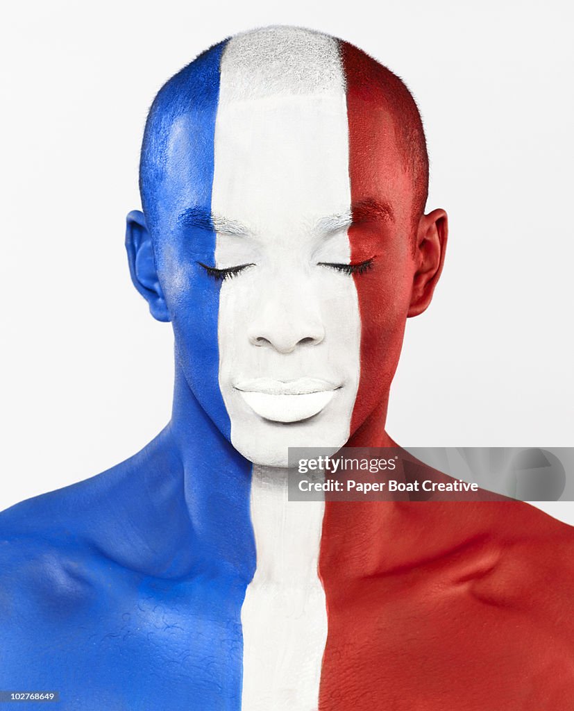 French flag painted on man's face