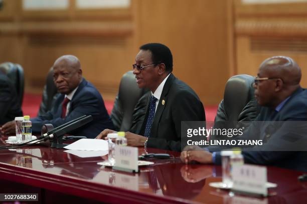 Prime Minister of the Democratic Republic of the Congo Bruno Tshibala Nzenze talks during a meeting with Chinese President Xi Jinping at the Great...