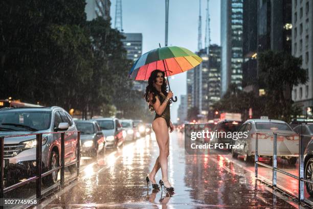 drag queen with rainbow umbrella at avenida paulista, sao paulo city, brazil - avenida paulista imagens e fotografias de stock