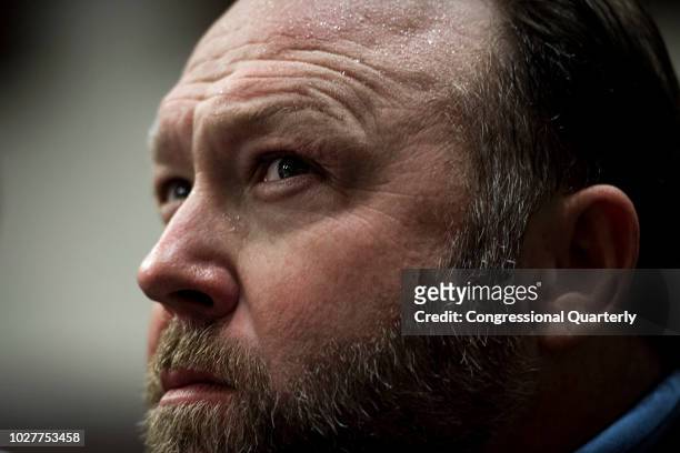 Alex Jones sits in on a Senate Select Intelligence Committee hearing in Dirksen Building as the Facebook COO and Twitter CEO testify on the influence...