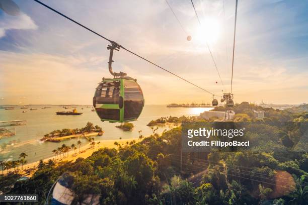cableway trip in sentosa island, singapore - singapore stock pictures, royalty-free photos & images
