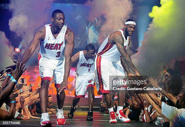 Chris Bosh, Dwyane Wade and LeBron James attend the Miami HEAT Summer of 2010 Welcome Event at AmericanAirlines Arena on July 9, 2010 in Miami,...