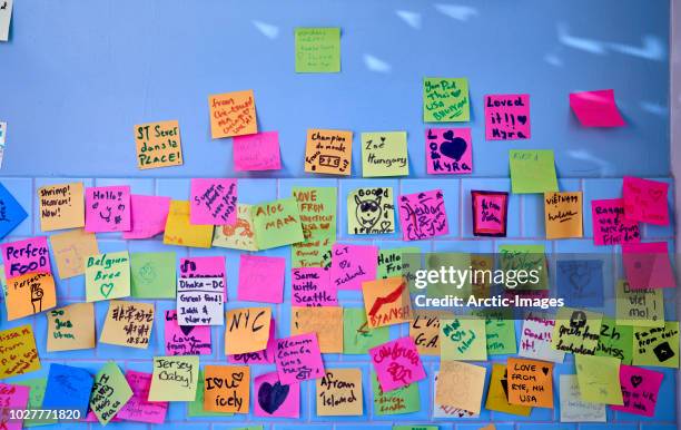 wall covered with colourful post it notes - sticking stock pictures, royalty-free photos & images