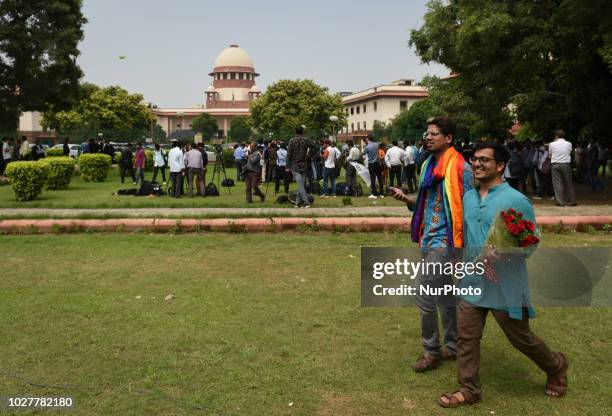 Indian members of the lesbian, gay, bisexual, transgender community celebrates outside the Supreme Court after the decision to strike down the...