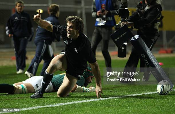 Conrad Smith of the All Blacks celebrates his try during the Tri-Nations match between the New Zealand All Blacks and South Africa Springboks at Eden...