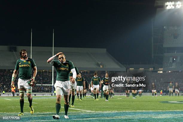 Victor Matfield and Bryan Habana of the Springboks walk from the field after the Tri-Nations match between the New Zealand All Blacks and South...