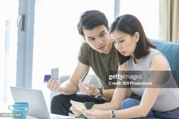 couple arguing about finances - bank statement stock pictures, royalty-free photos & images
