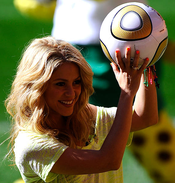 Colombia's singer Shakira, holding the Jo'bulani football that will be used for the final of the tournament, poses after a press conference on July...