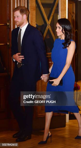 Britain's Prince Harry, Duke of Sussex, and his wife Meghan, Duchess of Sussex arrive to attend 100 Days to Peace in London on September 6 a gala...