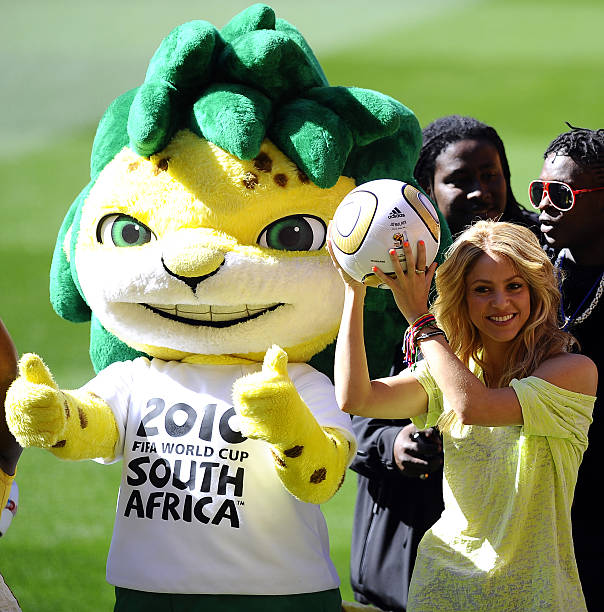 Colombian singer Shakira , flanked by Zakumi the official tournament mascot , holds the Jo'bulani football that will be used for the final after a...