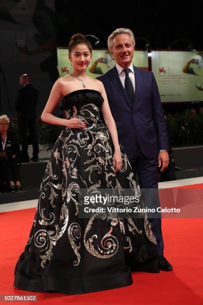 Guan Xiaotong and Jerome Favier walk the red carpet ahead of the Ying And 2018 Jaeger-LeCoultre Glory To The Filmaker Award to Zhang Yimou during the...