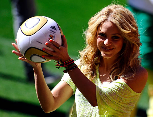 Colombia's singer Shakira, holding the Jo'bulani football that will be used for the final of the tournament, poses after a press conference on July...