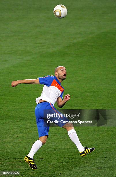 Demy De Zeeuw of the Netherlands kicks the ball during a Netherlands training session, ahead of the 2010 FIFA World Cup Final, at Soccer City Stadium...