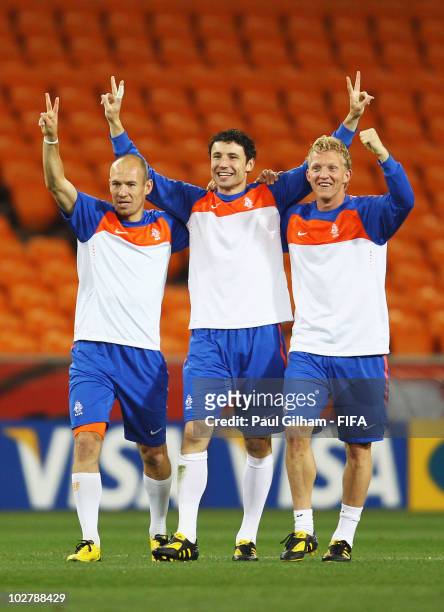 Arjen Robben, Mark Van Bommel and Dirk Kuyt of the Netherlands celebrate during a Netherlands training session, ahead of the 2010 FIFA World Cup...