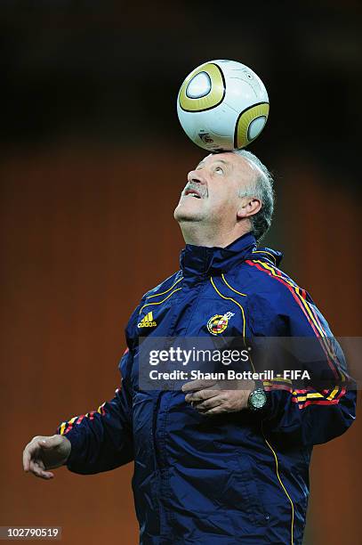 Vicente del Bosque head coach of Spain balances a ball on his head during a Spain training session, ahead of the 2010 FIFA World Cup Final, at Soccer...