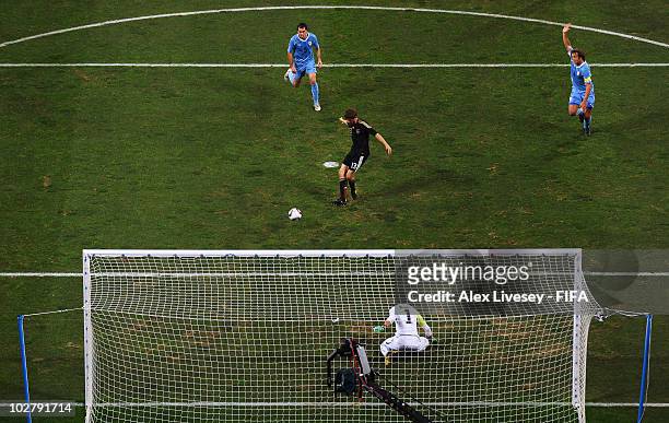 Thomas Mueller of Germany scores his side's first goal during the 2010 FIFA World Cup South Africa Third Place Play-off match between Uruguay and...