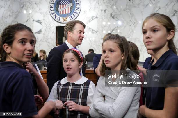 Supreme Court nominee Judge Brett Kavanaugh poses for photos former players of the youth basketball team he coached during a break in his Senate...