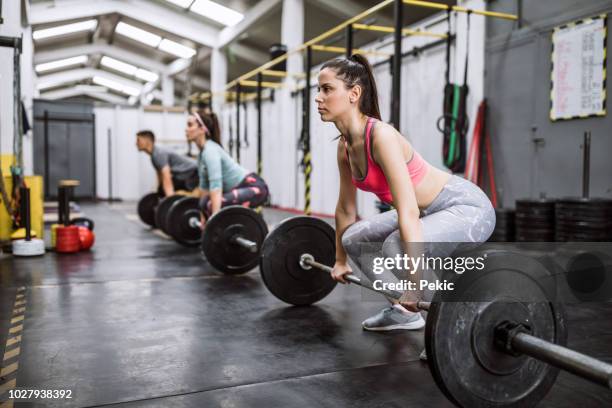 heavy weightlifting in gym - deadlift stock pictures, royalty-free photos & images