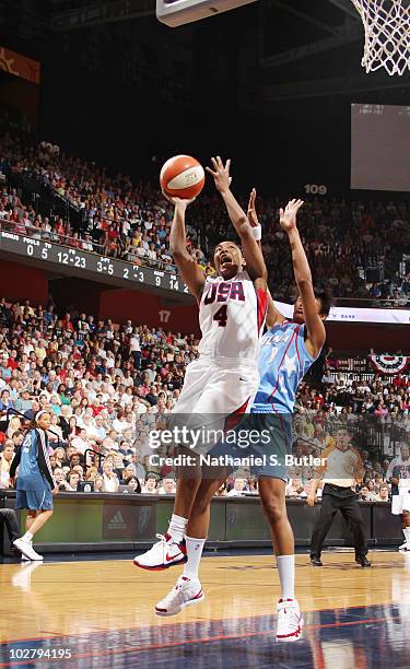 Cappie Pondexter of the USA Basketball Team shoots against Iziane Castro Marques of the WNBA during the Stars at the Sun exhibition game on July 10,...