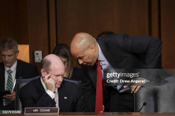 Sen. Chris Coons and Sen. Cory Booker talk with each other after Booker questioned Supreme Court nominee Judge Brett Kavanaugh before the Senate...