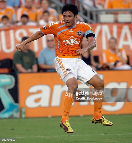 Brian Ching of the Houston Dynamo follows through after putting a shot on goal in the first half against the Columbus Crew at Robertson Stadium on...